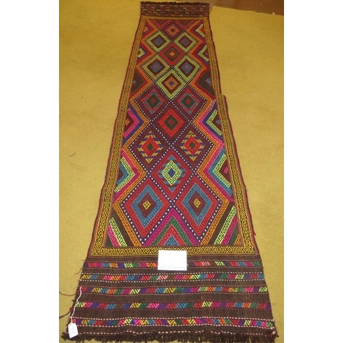 919 - A Persian runner colourful diamond pattern. Good clean condition. 244cm x 58cm.