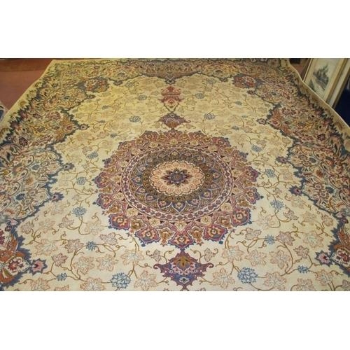 921 - An excellent Persian Meshed carpet, large central motif, set on cream ground 393cm x 272cm. Very goo... 