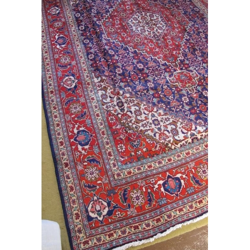 926 - A fine Persian Tabriz carpet, blue, red, cream in excellent condition and good colour. 311cm x 205cm... 