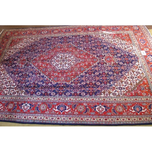 926 - A fine Persian Tabriz carpet, blue, red, cream in excellent condition and good colour. 311cm x 205cm... 