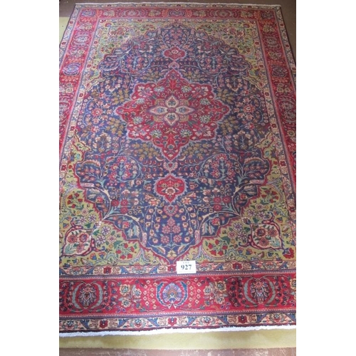 927 - A good Persian Tabriz carpet, large central floral motif on a pale green field surrounded by a wide ... 