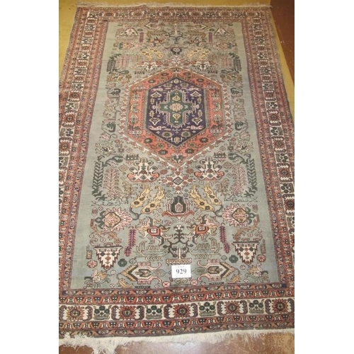 929 - Early-mid 20th century rug purchased in Tanzania. Pale blue ground, even wear/colour. 263cm x 173cm.