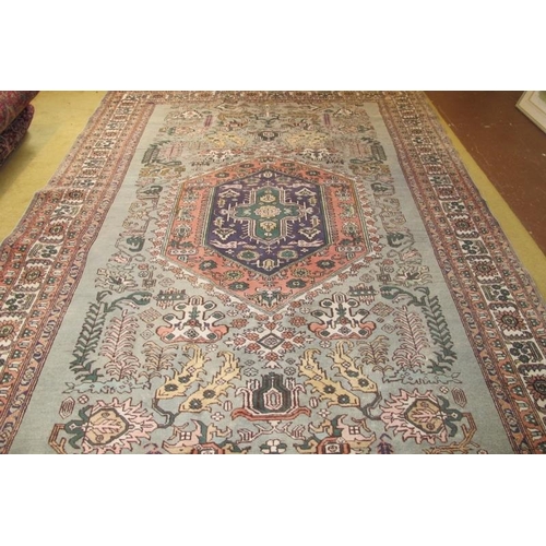 929 - Early-mid 20th century rug purchased in Tanzania. Pale blue ground, even wear/colour. 263cm x 173cm.