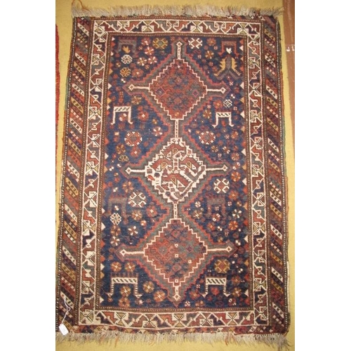 931 - Two early 20th century Persian rugs. 125cm x 83cm in good condition, three diamond pattern, the othe... 