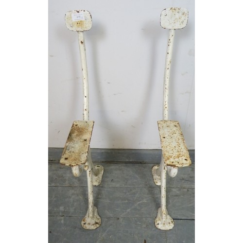 878 - A pair of antique cast iron bench ends painted white, featuring acanthus leaf decoration. 
Condition... 