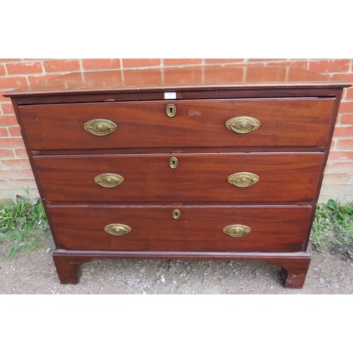 866 - A George III mahogany straight front chest of three long graduated oak-lined drawers with pressed gi... 