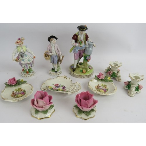 141 - A collection of Dresden and other porcelain including two pairs of figures, a single figure, two pai... 