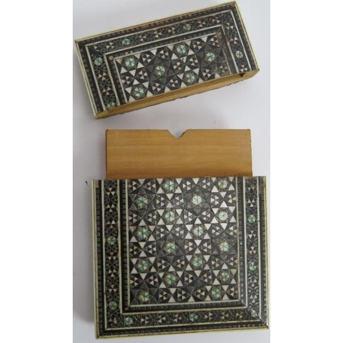 270 - An antique Indo-Persian card case decorated with bone and metal micro-mosaics. 10cm x 7.5cm.
Conditi... 