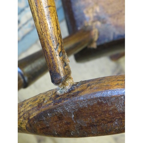 729 - A good 18th century elm Windsor hoop back chair, on turned canted supports with an ‘H’ stretcher. c1... 