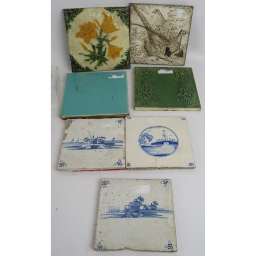 100 - A mixed lot including three Delft tiles, 4 other tiles, A Staffordshire pottery tobacco jar, seven e... 