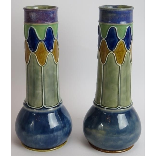 106 - A pair of Doulton Lambeth stoneware Baluster vases. A pair of Royal Doulton stone ware vases signed ... 