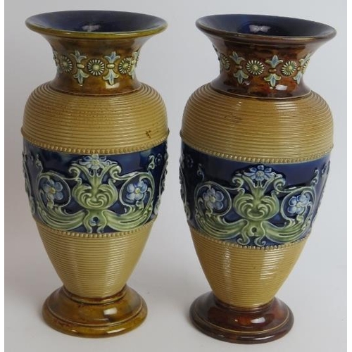 106 - A pair of Doulton Lambeth stoneware Baluster vases. A pair of Royal Doulton stone ware vases signed ... 