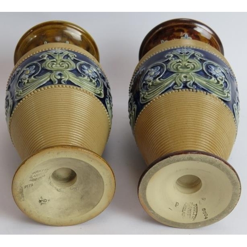 106 - A pair of Doulton Lambeth stoneware Baluster vases. A pair of Royal Doulton stone ware vases signed ... 