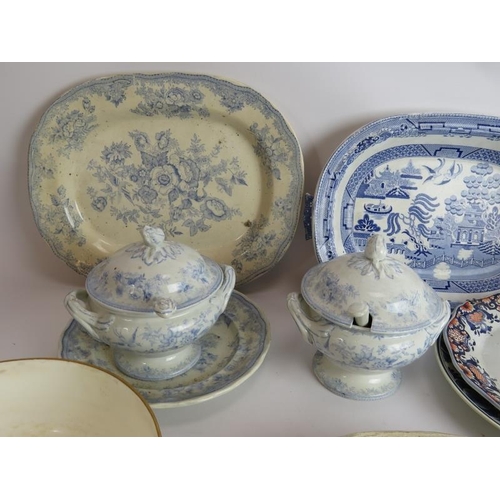 115 - A mix of mainly ceramic kitchen and table ware including plates, platters, tureens, bread plate and ... 