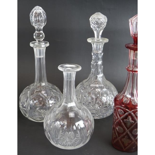 118 - Four antique cut glass decanters, a similar claret jug, an early 19th century carafe and a ruby cut ... 