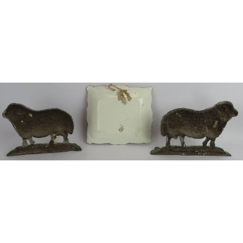 133 - Two antique cast iron sheep doorstops and a Sunderland Lustre ware plaque 'Thou God Seest Me'. (3).
... 