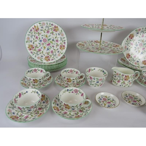 142 - A 40 piece Mintons tea set in Haddon Hall pattern including plates, cake stand, jam pots, jug, sugar... 