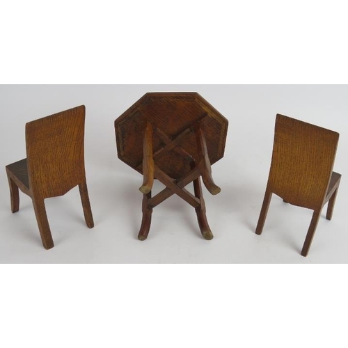 149 - A miniature period oak side table, possible an apprentice piece, and two similar dining chairs, each... 