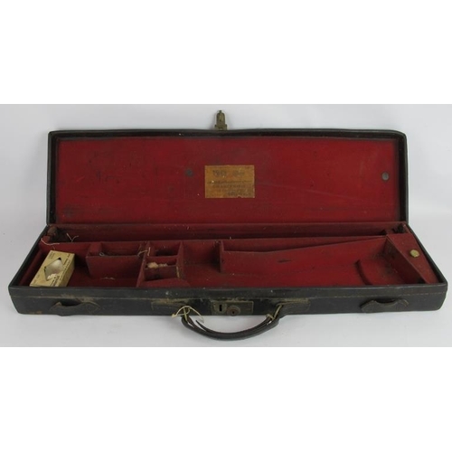 15 - An antique leather shotgun case by James Macnaughton & Sons, Edinburgh. Red felt lining, brass fitti... 