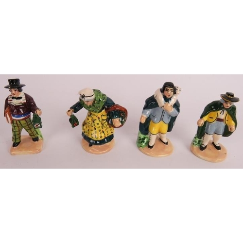 153 - A collection of small hand painted continental pottery figures portraying country peasants. Tallest:... 