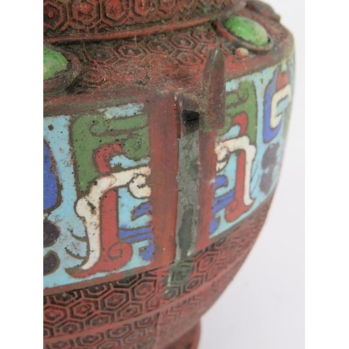 155 - A Chinese bronze urn with Champlevé enamel decoration to shoulder and glazed potter Cabochons. Heigh... 