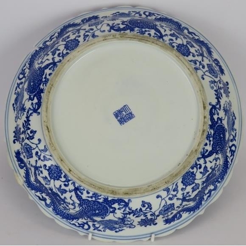 156 - An antique Chinese porcelain plate decorated in the famille, Rose style and a 20th century Chinese b... 