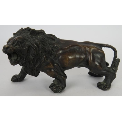 158 - A vintage bronze roaring lion , an antique pen wipe, antique desk bell, cast brass easel frame and a... 