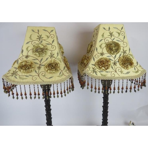 166 - A pair of palm leaf column table lamps with bronzed finish an ornate beaded shades. Overall height 7... 