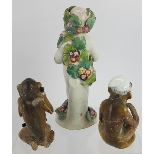 186 - An 18th century Derby porcelain figure of a child with flowers and two 19th century porcelain monkey... 