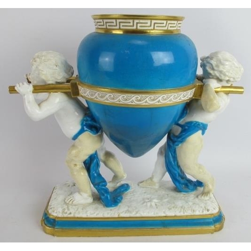 195 - A 19th century Mintons porcelain vase in the form of two putti carrying an urn. White and turquoise ... 