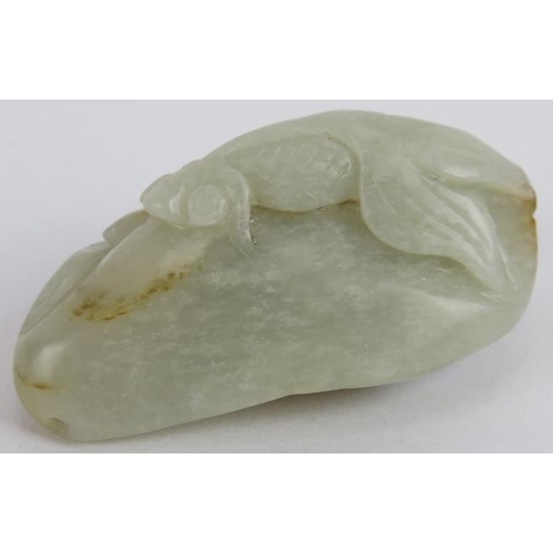 213 - A Chinese carved celadon and russet Jade boulder, in the form of a fish, pebble and water foliage, M... 