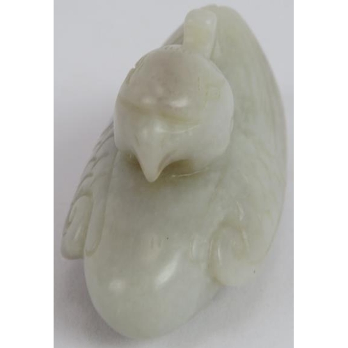 216 - A Chinese carved pale celadon Jade Phoenix, Ming style but likely Qing, 8cm long x 4cm high.
Provena... 