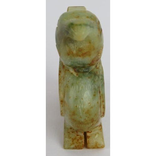 223 - A Chinese carved celadon and russet Jade Phoenix, Ming style but likely Qing, 8cm high x 9cm long.
P... 