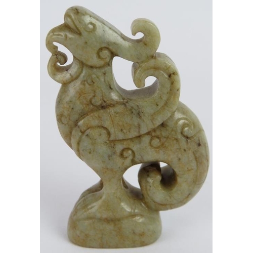 224 - A Chinese carved celadon Jade Phoenix with black Jade speckles, Ming style but likely Qing, 7.5cm hi... 