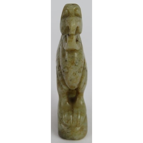 224 - A Chinese carved celadon Jade Phoenix with black Jade speckles, Ming style but likely Qing, 7.5cm hi... 