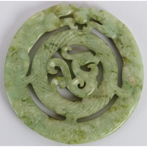 231 - A Chinese carved black speckled celadon Jade disc, Ming style but likely Qing, 7cm diameter. 
Proven... 