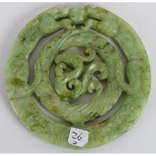 231 - A Chinese carved black speckled celadon Jade disc, Ming style but likely Qing, 7cm diameter. 
Proven... 