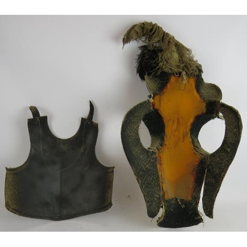 244 - A steel replica armour breast plate, a pair of similar leg armour plates and a composite horse head ... 