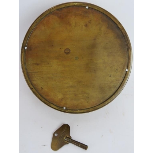 245 - A brass Sestrel ships clock with painted dial, W.H. Kerr Ltd., Milford Haven. Key present. Dial Diam... 