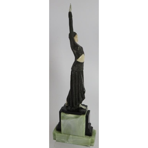 252 - An Art Deco style female dancer mounted on a green onyx style plinth, in the style of Chiparus. Heig... 