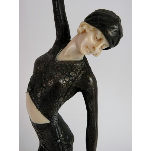 252 - An Art Deco style female dancer mounted on a green onyx style plinth, in the style of Chiparus. Heig... 