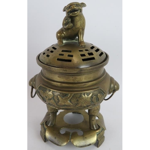 253 - A bronze Chinese Censer, cover and stand with figural decoration, a porcelain Buddha with seal mark ... 