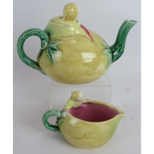 267 - A 19th century Majolica tea pot and jug in the form of a Chinaman and melon. Teapot height: 13.5cm. ... 