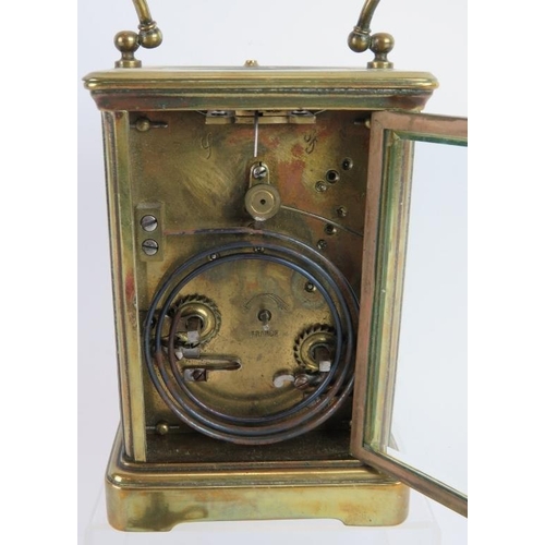 281 - A French 8 day repeating carriage clock in brass case with white dial. Overall height: 17cm. Key pre... 