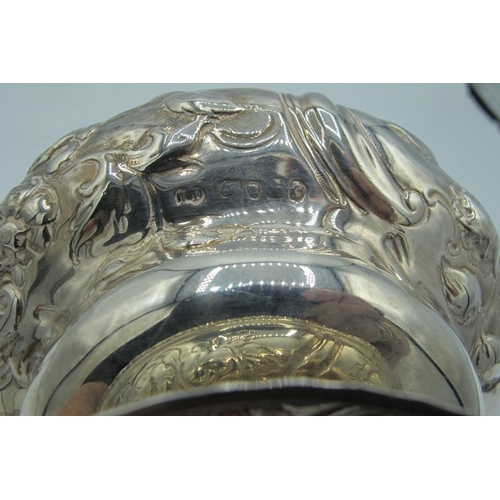 301 - A fine Victorian silver pedestal bowl, embossed with scrolls and flowers. Approx: 5