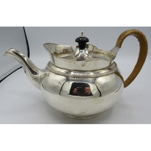 304 - A good quality Victorian silver teapot with wicker handle. London 1852. Thomas's Bond Street. 21.4 t... 