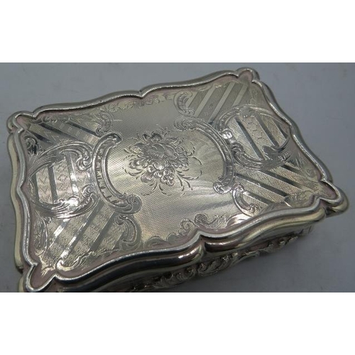 318 - A heavy Victorian silver table snuff box with presentation inscription and scrolls and flowers, with... 