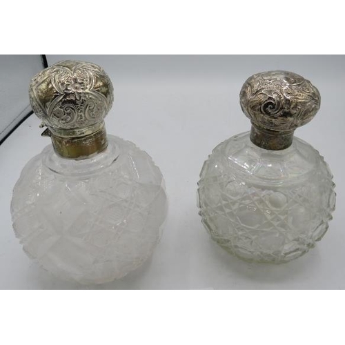 320 - Two large hobnail cut scent bottles with silver embossed tops. London 1893 and one with worn hallmar... 