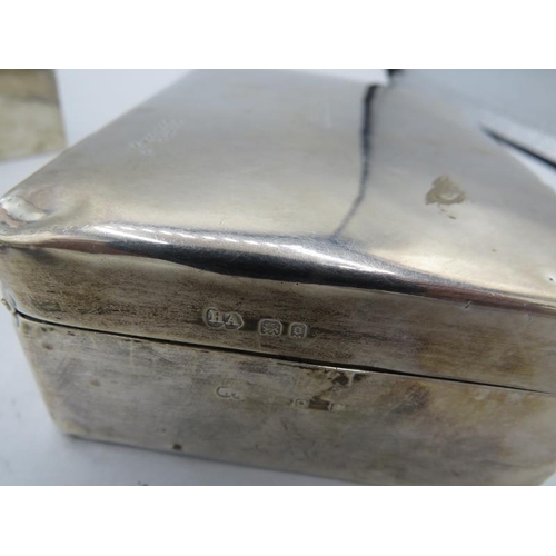 324 - A silver cigarette box. London 1929. Engraved 'Sylvia Xmas in England 1929-30'. The outer silver cas... 