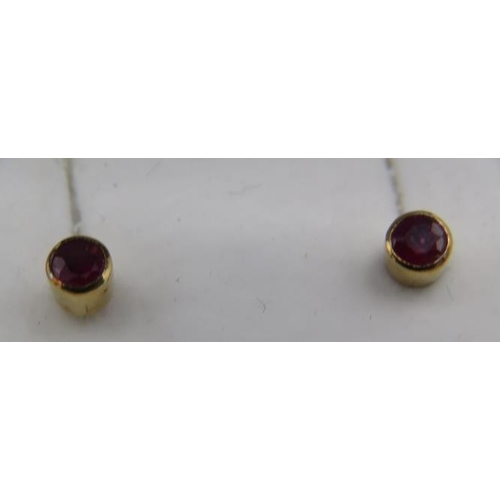 332 - A pair of 9ct gold ruby set stud earrings, approx 4mm, approx weight 1 gram, boxed.
Condition report... 